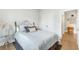 Cozy bedroom with comfortable bed, soft lighting and hardwood floors at 532 Fern Tree Dr, Summerville, SC 29486