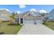 Charming brick home featuring a well-manicured lawn and a two-car garage at 532 Fern Tree Dr, Summerville, SC 29486