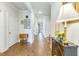 Inviting hallway with hardwood floors, neutral walls and decorative accents at 532 Fern Tree Dr, Summerville, SC 29486