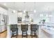 Bright kitchen features stainless steel appliances, granite countertops, island with seating, and hardwood floors at 532 Fern Tree Dr, Summerville, SC 29486