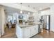 Open-concept kitchen with island sink and breakfast bar; view into the living room with fireplace and built-ins at 532 Fern Tree Dr, Summerville, SC 29486