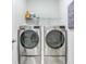 Efficient laundry room featuring modern washer and dryer, plus shelving for storage at 532 Fern Tree Dr, Summerville, SC 29486