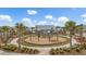 A playground with swings and slides surrounded by palm trees at 532 Fern Tree Dr, Summerville, SC 29486