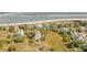 Stunning aerial view of homes near the beach, showcasing the natural beauty of the surrounding environment at 65 Ocean Point Dr, Isle of Palms, SC 29451