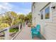Spacious outdoor deck features colorful chairs, a grill, and a view of the well-maintained backyard at 65 Ocean Point Dr, Isle of Palms, SC 29451