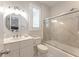 Clean bathroom with white cabinets, shower and ample natural light at 65 Ocean Point Dr, Isle of Palms, SC 29451