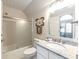 Bathroom featuring a shower-tub combo with glass doors, granite countertop, and a white vanity at 65 Ocean Point Dr, Isle of Palms, SC 29451