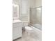 Bright bathroom with white fixtures, a shower and ample natural light at 65 Ocean Point Dr, Isle of Palms, SC 29451