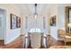 Bright dining room features a glass top table, bench seating, and lots of natural light from the bay window at 65 Ocean Point Dr, Isle of Palms, SC 29451