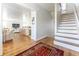 Inviting foyer with hardwood floors and open view to living area and kitchen at 65 Ocean Point Dr, Isle of Palms, SC 29451