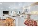 Modern kitchen featuring stainless appliances, granite countertops, white cabinetry and an open design at 65 Ocean Point Dr, Isle of Palms, SC 29451