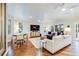 Bright living room featuring a ceiling fan, hardwood floors, comfortable seating, and a stylish area rug at 65 Ocean Point Dr, Isle of Palms, SC 29451