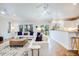Bright living room featuring hardwood floors, comfortable seating, ceiling fans, and lots of natural light at 65 Ocean Point Dr, Isle of Palms, SC 29451