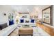 Open concept living space with a comfortable white sofa, stylish coffee table, and hardwood floors throughout at 65 Ocean Point Dr, Isle of Palms, SC 29451