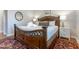 Comfortable main bedroom with king bed, rug and ample natural light at 65 Ocean Point Dr, Isle of Palms, SC 29451