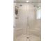 Modern glass enclosed shower featuring dual showerheads and integrated bench seating at 65 Ocean Point Dr, Isle of Palms, SC 29451