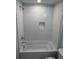 This bathroom features a shower and tub combination and subway tile at 651 Magnolia Rd, Charleston, SC 29407