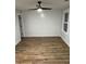 Brightly lit bedroom features a modern ceiling fan, LVP flooring, and shiplap accent wall at 651 Magnolia Rd, Charleston, SC 29407