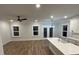 Kitchen features white cabinets, stainless steel appliances, and an island with a sink at 651 Magnolia Rd, Charleston, SC 29407