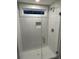 This glass-enclosed shower features white subway tile and a built-in niche at 651 Magnolia Rd, Charleston, SC 29407