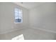 A vacant bedroom with neutral carpeting and a single window allowing ample natural light at 715 Rumbling Leaf Ln, Summerville, SC 29486
