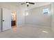 Sun-filled bedroom with neutral carpet, ceiling fan, and an ensuite bathroom at 715 Rumbling Leaf Ln, Summerville, SC 29486