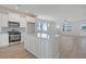 Modern kitchen featuring white cabinets, stainless steel appliances, and a center island with quartz countertops at 715 Rumbling Leaf Ln, Summerville, SC 29486