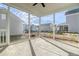 Enclosed screened porch with a view of the backyard and neighboring homes on a sunny day at 715 Rumbling Leaf Ln, Summerville, SC 29486