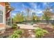 Landscaped backyard with a patio, greenery, and a firepit at 729 Quintan St, Summerville, SC 29486