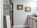 Modern bathroom with walk-in shower, granite countertops, white cabinets, and stylish decor at 729 Quintan St, Summerville, SC 29486