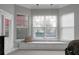 Main bedroom showing the bay window area with window seating and three large windows at 729 Quintan St, Summerville, SC 29486