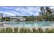Outdoor community pool with clear water, slides, and ample lounge chairs for residents at 729 Quintan St, Summerville, SC 29486