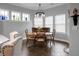 Dining room featuring large windows, tiled flooring, dining table and chairs at 729 Quintan St, Summerville, SC 29486
