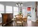 Dining room featuring a round dining table, tiled floors, chandelier, and buffet at 729 Quintan St, Summerville, SC 29486