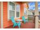 Cozy front porch featuring comfortable blue chairs and ample natural light, ideal for relaxation at 729 Quintan St, Summerville, SC 29486