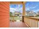 View from porch through columns showcasing another home across the street at 729 Quintan St, Summerville, SC 29486