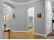 Hallway featuring elegant arches, detailed trim, stylish decor, and hardwood flooring at 729 Quintan St, Summerville, SC 29486