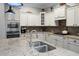 Close-up of a kitchen featuring stainless steel appliances, granite countertops, and ample storage space at 729 Quintan St, Summerville, SC 29486