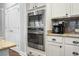 Kitchen featuring stainless steel appliances, granite countertops, white cabinets, and lots of storage at 729 Quintan St, Summerville, SC 29486
