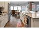 Open kitchen with granite counters, stainless steel appliances, and seamless flow to dining area at 729 Quintan St, Summerville, SC 29486