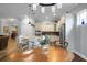Bright and airy kitchen featuring white cabinets, stainless steel appliances, and an adjacent dining area at 729 Quintan St, Summerville, SC 29486
