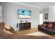 Comfortable living room with hardwood floors, plush leather seating, and decorative fireplace at 729 Quintan St, Summerville, SC 29486