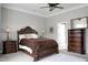 Comfortable main bedroom with crown molding, ceiling fan, and en-suite bathroom at 729 Quintan St, Summerville, SC 29486