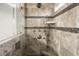 This bathroom's shower features multiple shower heads, tile surround, and a built in seat at 729 Quintan St, Summerville, SC 29486
