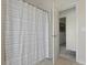 Bathroom featuring decorative shower curtain and an open doorway at 8592 Sentry Cir, North Charleston, SC 29420