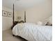 Cozy bedroom featuring a four-poster bed with soft, neutral bedding and textured accents at 8592 Sentry Cir, North Charleston, SC 29420