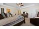 A spacious bedroom features a ceiling fan, cozy seating area and ample closet space at 8592 Sentry Cir, North Charleston, SC 29420