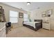 Bright bedroom includes daybed, shelving, desk, chair, and lots of wall decorations at 8592 Sentry Cir, North Charleston, SC 29420