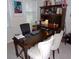 Bright office space with a large wooden desk and ample storage, perfect for remote work at 8592 Sentry Cir, North Charleston, SC 29420