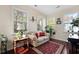 Bright sunroom filled with natural light from multiple windows, perfect for relaxation and plants at 8592 Sentry Cir, North Charleston, SC 29420